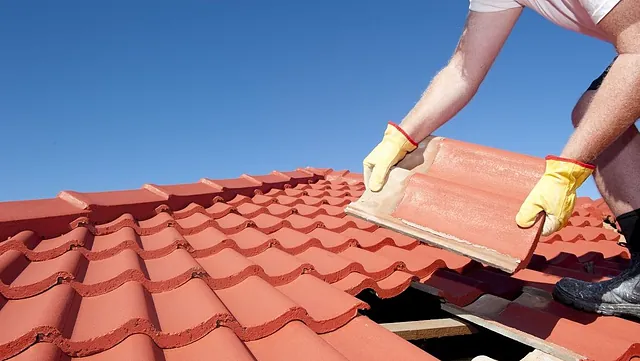 Our team working on a roof.